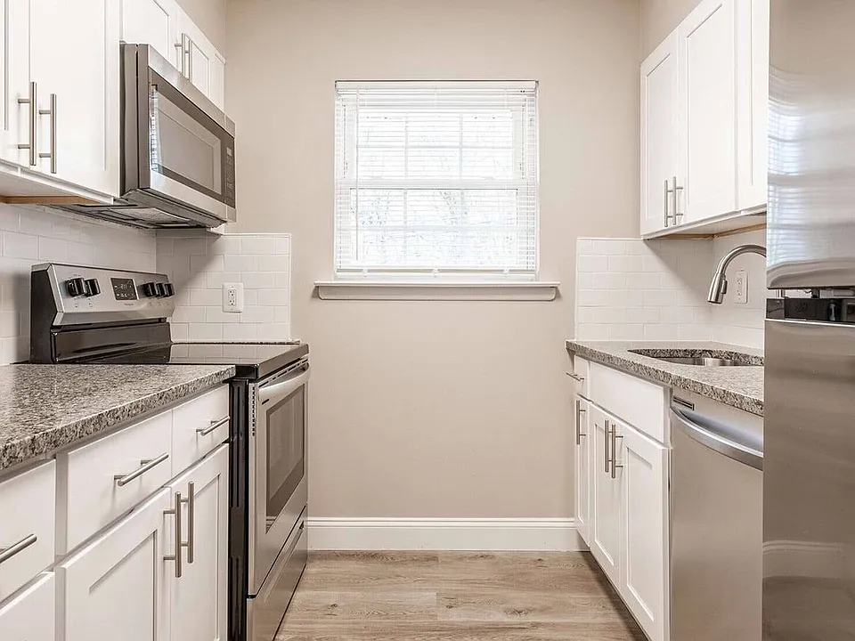 Transform your lifestyle at Toms River Apartments. This stunning kitchen features modern appliances, sleek countertops, and ample natural light, perfect for culinary enthusiasts. Don't miss out on your dream homeschedule a visit today!