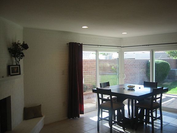 Dining Room w/ fireplace and “wall of glass”