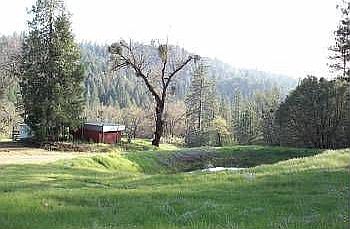 Pond and barn overlooking ho