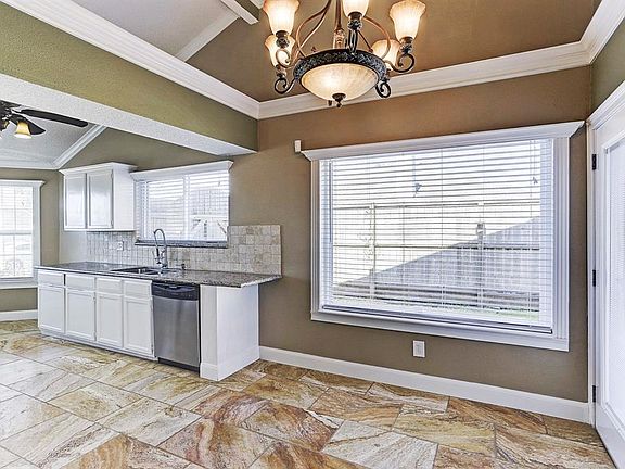 Completely open to the dining space and living room, the kitchen has a great flow for entertaining. Access to the large backyard and paver patio to the left- all with views through the recent double paned windows throughout!