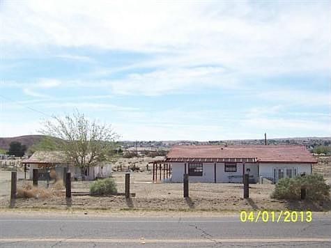 Front - House is on the right.  Outbuilding on the left