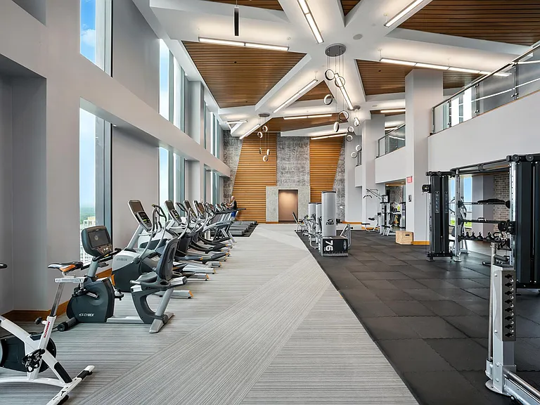 Rooftop fitness center with floor-to-ceiling windows