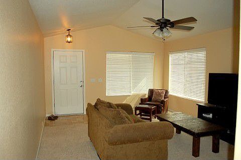 Upon Entry, Warm & Inviting Living Room with Vaulted Ceiling