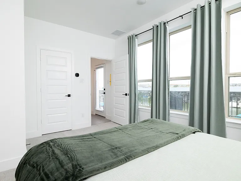 Bedroom #2 has a queen bed with extra pillows and blankets available