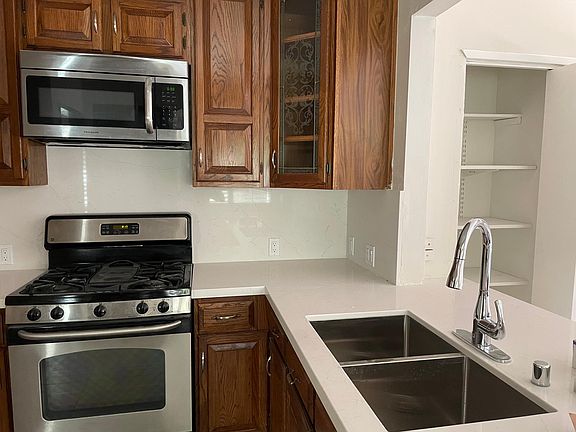 Kitchen with new white marble quartz countertops