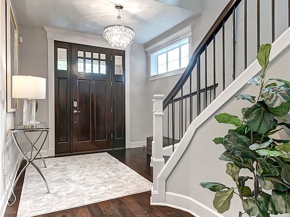 Another view of entry from garage area. Engineered hardwood throughout.