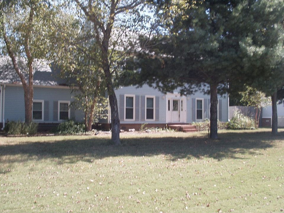 front view thru trees