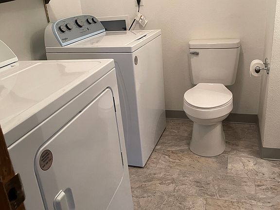 Half bath w/sink and laundry, downstairs.