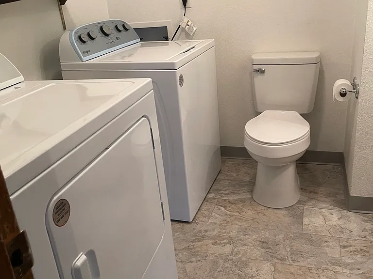 Half bath w/sink and laundry, downstairs.