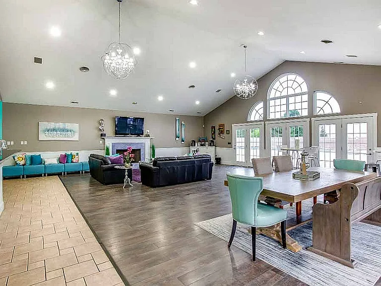 The clubhouse is available to residents and includes a full kitchen, fireplace, and dining area.