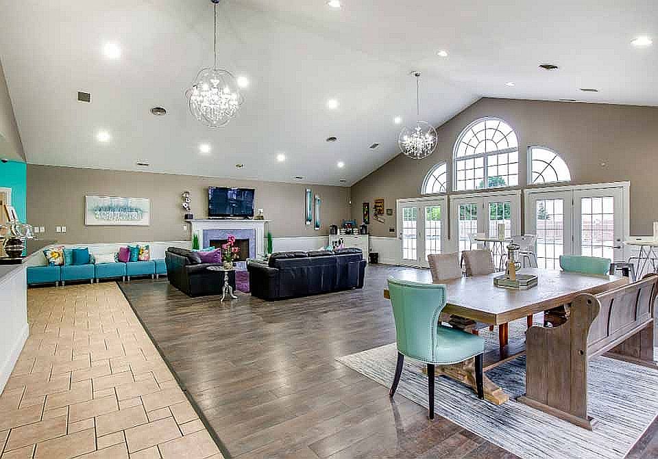 The clubhouse is available to residents and includes a full kitchen, fireplace, and dining area.