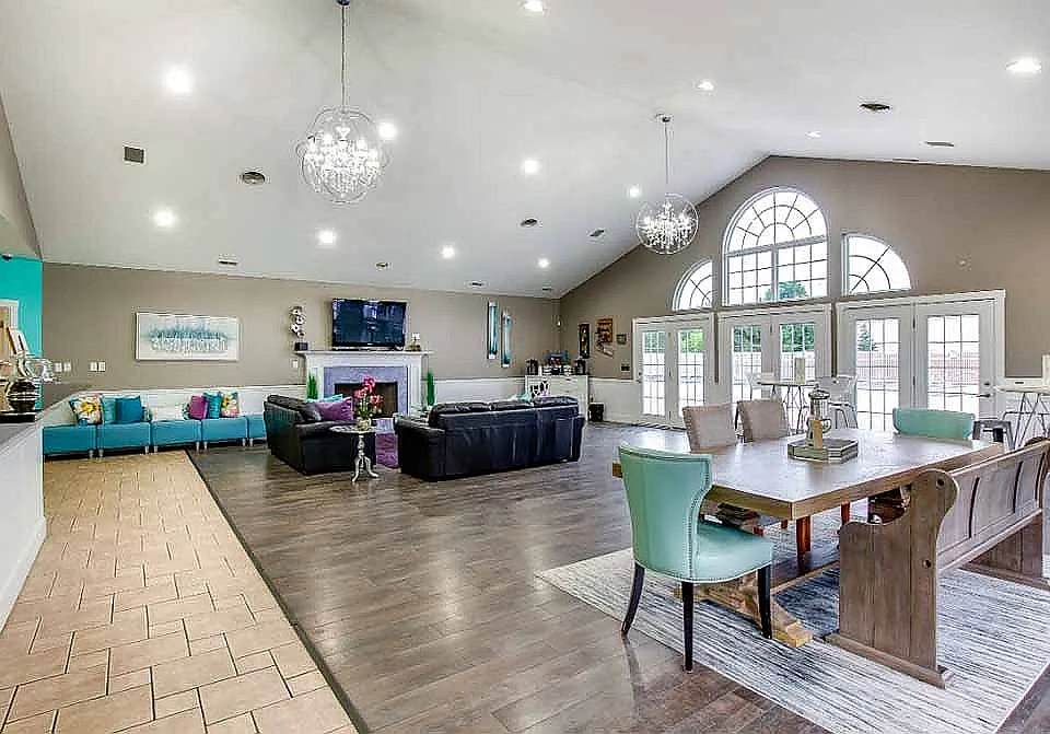 The clubhouse is available to residents and includes a full kitchen, fireplace, and dining area.