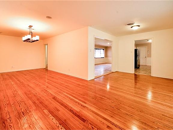 Gleaming hardwoods in dining and living areas.
