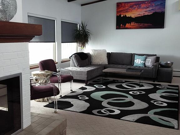 Formal living room with mountain views and deck access