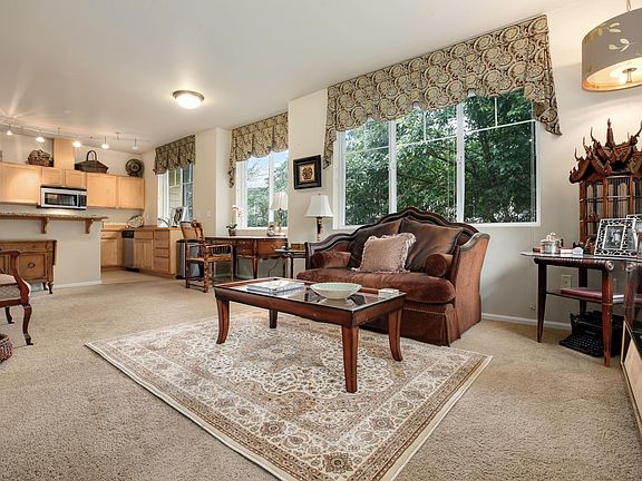 Bright open kitchen/living room floor plan with lots of wind