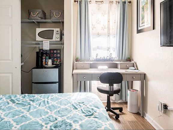Kitchenette and dedicated workspace in private bedroom