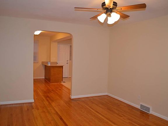 Living Room Looking Into Dining Room and Kitchen, New High E