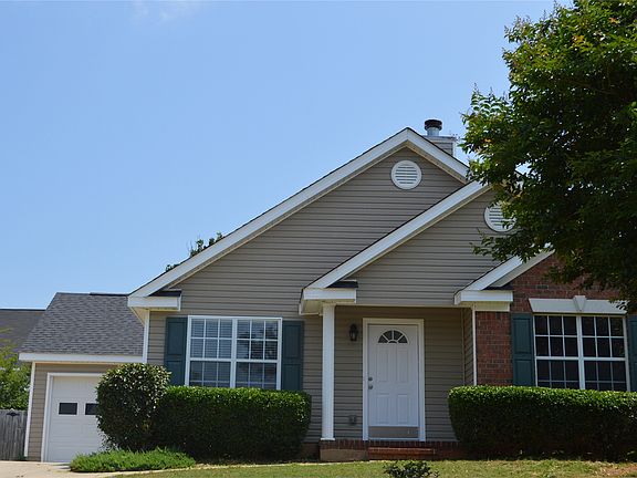 The front of our home. It has a single car garage.