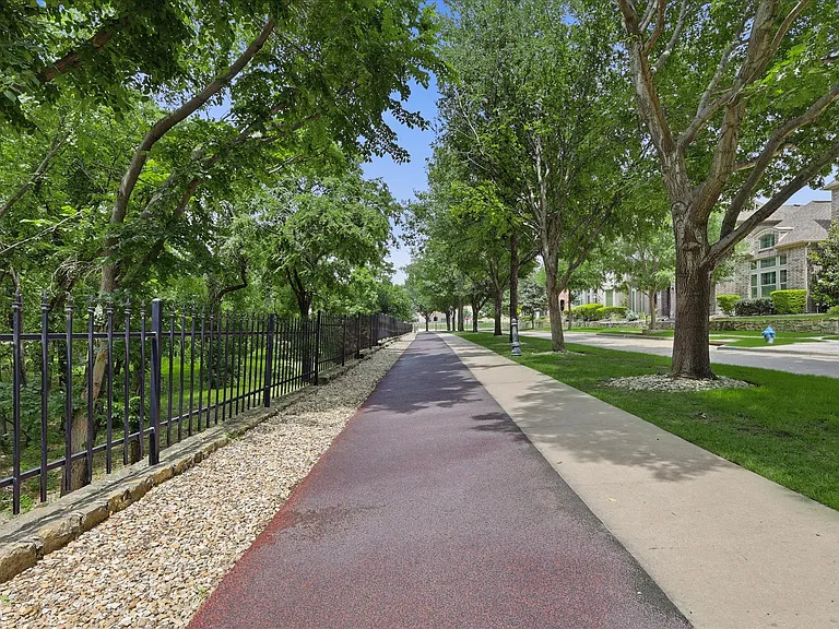 Dr. Kenneth Cooper Park just steps away This green space features a dedicated, dual-surface walking and jogging trail designed for maximum comfort and safety. Utilize the smooth concrete walkway or the specialized, impact-absorbing rubberized track.