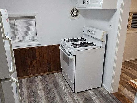 Efficiency Kitchen with New Windows & Paint.