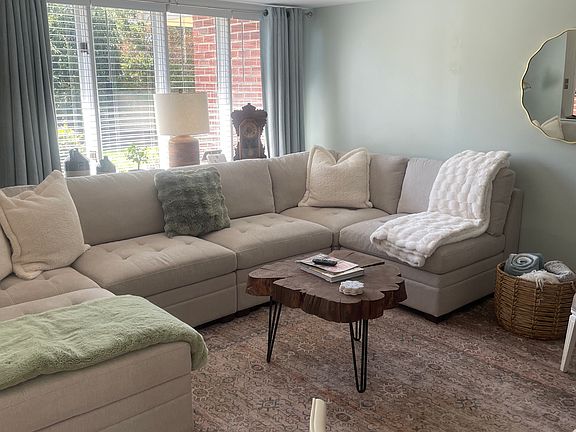 Living room with wood burning fireplace