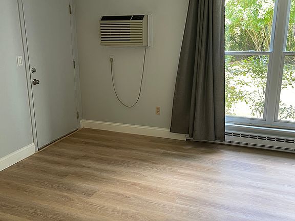 85 Wellington,
Part of the Living Room with a door to the Back Entrance and Basement.