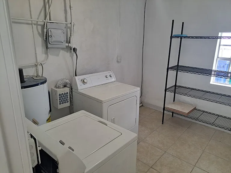 Utility Storage & Laundry Room with Washer and Dryer - View 1.