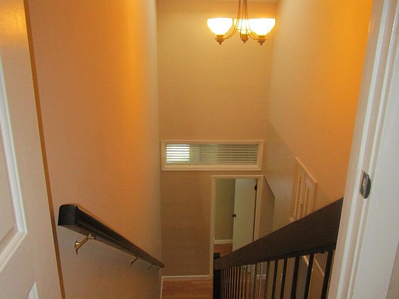 Looking down the stairs at the "Home Office" with balcony