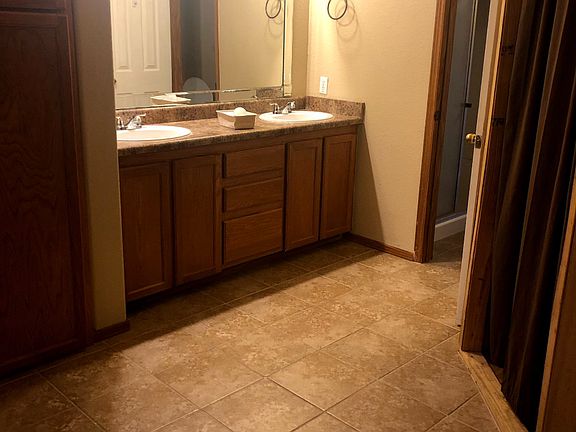 Large master bathroom with double sinks, walk in closet, separate shower/toilet.