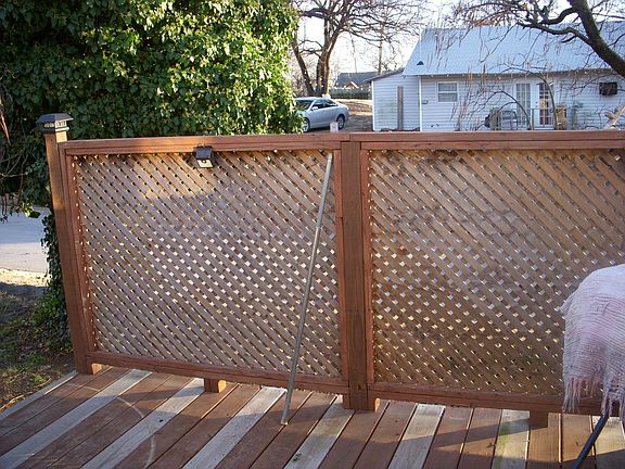Looking outside from the kitchen on to the deck, the privacy fencing blocks the view from the street.