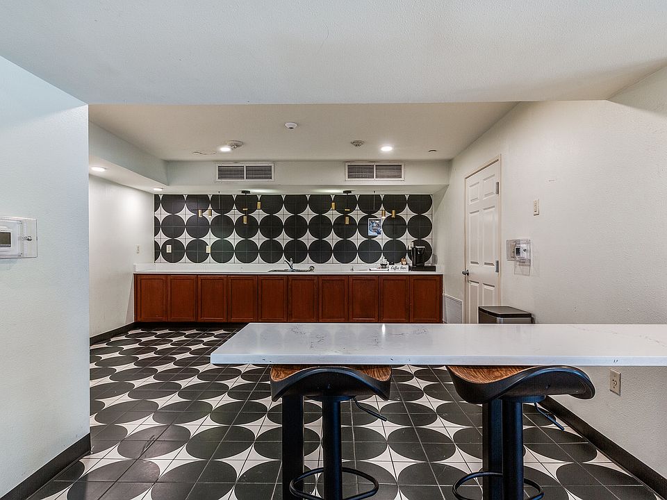 A modern hangout spot where residents can grab coffee, study, or unwind.