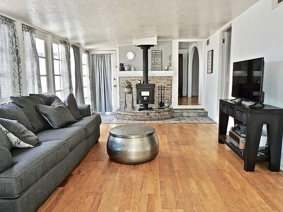 Beautiful Sunroom Surrounded By Fixed Bay Windows.