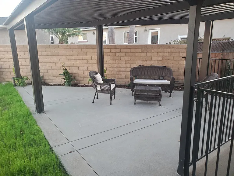 Side patio area with furniture