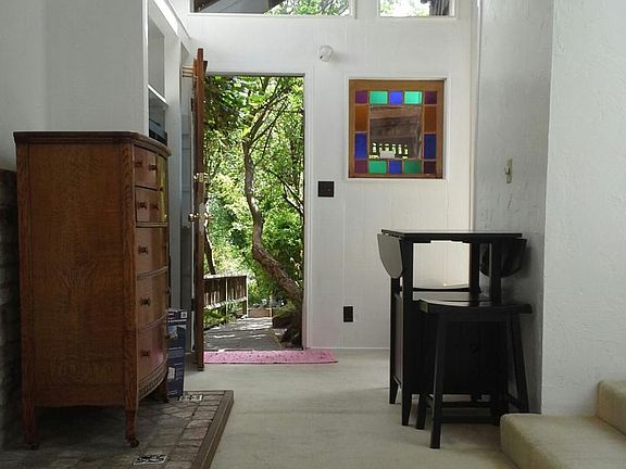 Living room, looking towards front door.