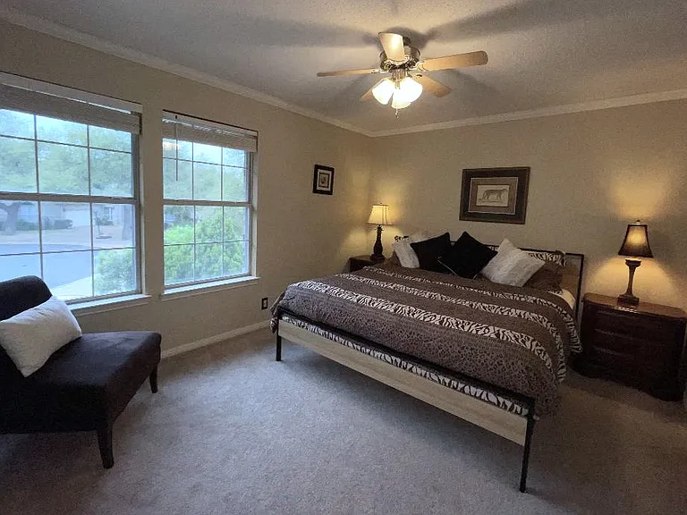 One of two king beds, the 'Safari Suite' features tree top views, a walk in closet, bedside charging strips.