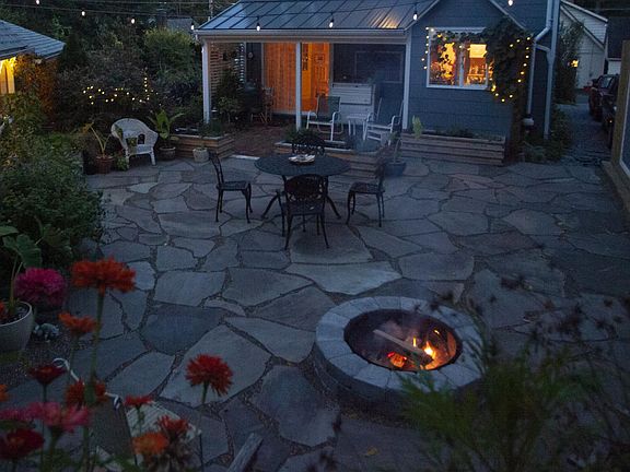 Another patio photo. Here you can see the main house in the middle, the shed to the right and the studio to the left.