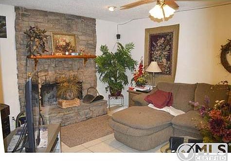 Great living area features stone fireplace
