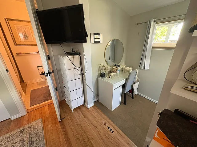 main floor bedroom with on suite, added office/sitting room