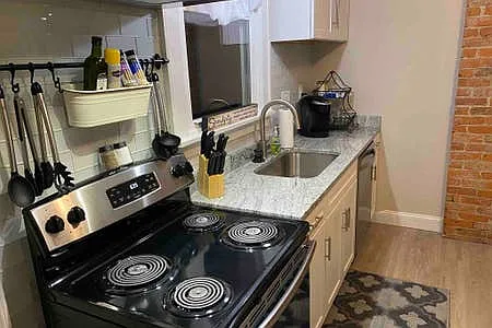 Kitchen with stainless steel appliances, dishwasher & garbage disposal