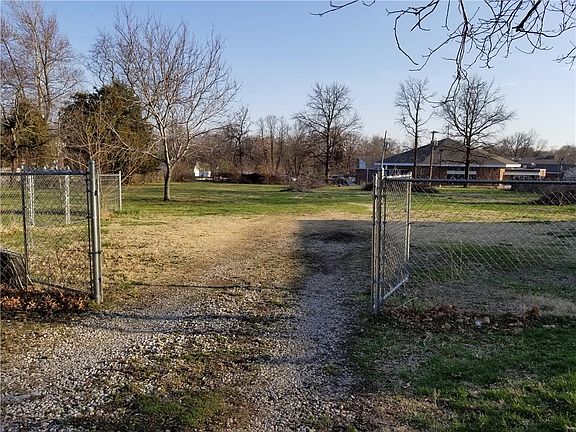 Double gated entry to outbuilding and fully fenced (5' high) back acreage approx 160' w x 213' d perfect for play, gardening, pe