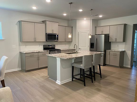 C-shaped kitchen, there is one more wall of cabinets in the front wall (not shown here)