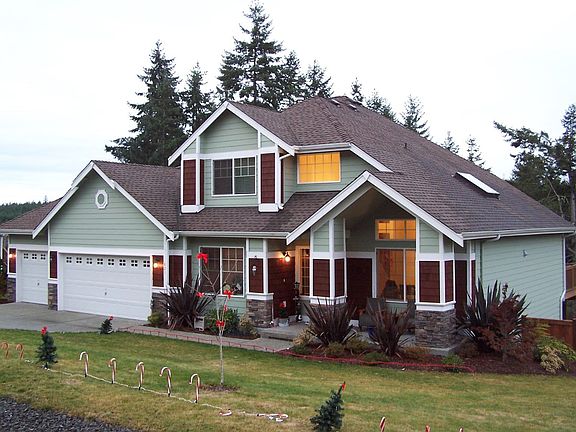 Exterior w/ custom landscaping.