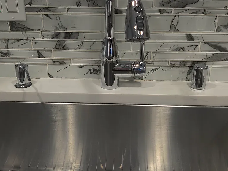 kitchen sink -adjustable and garbage disposal.