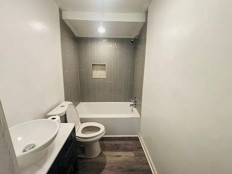 New renovated bathroom with a tile wall
