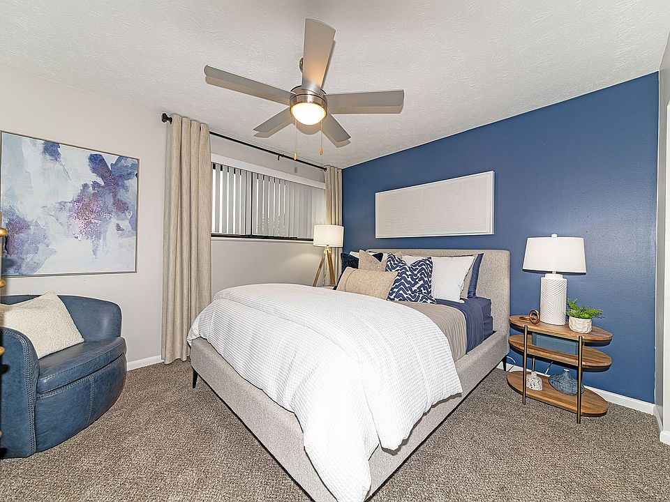 Cozy bedroom with carpet and ceiling fan