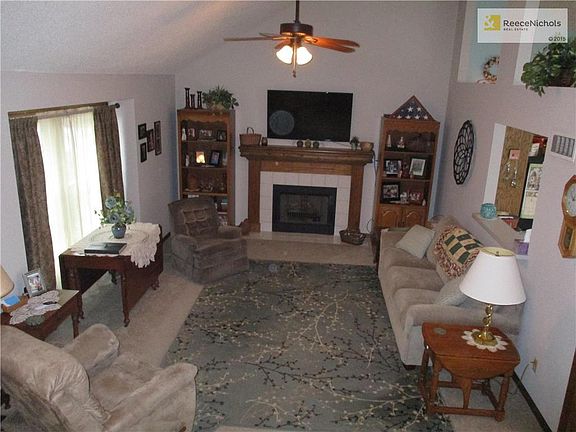 Walk in the front door to your cozy living room with fireplace and kitchen pass-through. Vaulted cei