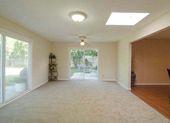 Skylit family room has two sliders to TWO terraces!