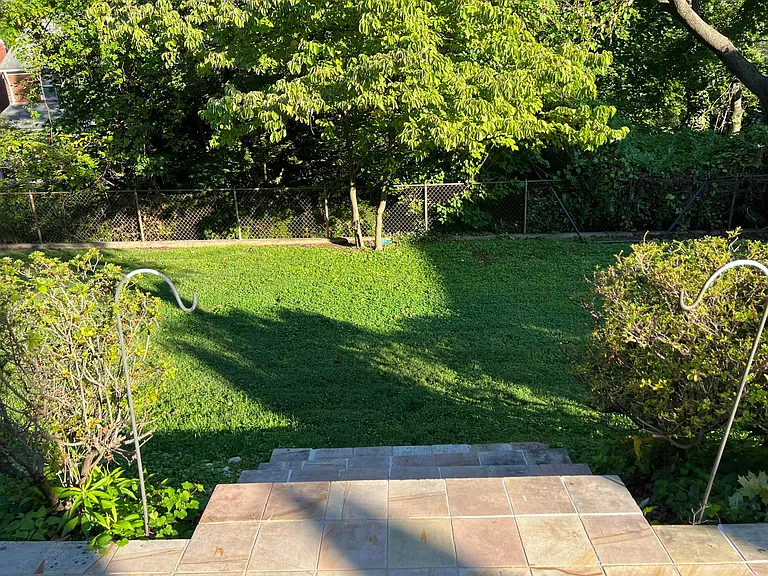 Patio steps down to level, rear yard