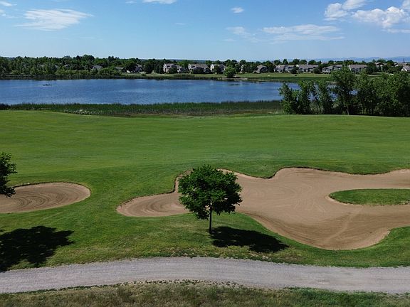 Overlooking the 15th Hole with Lake and Mountain Views