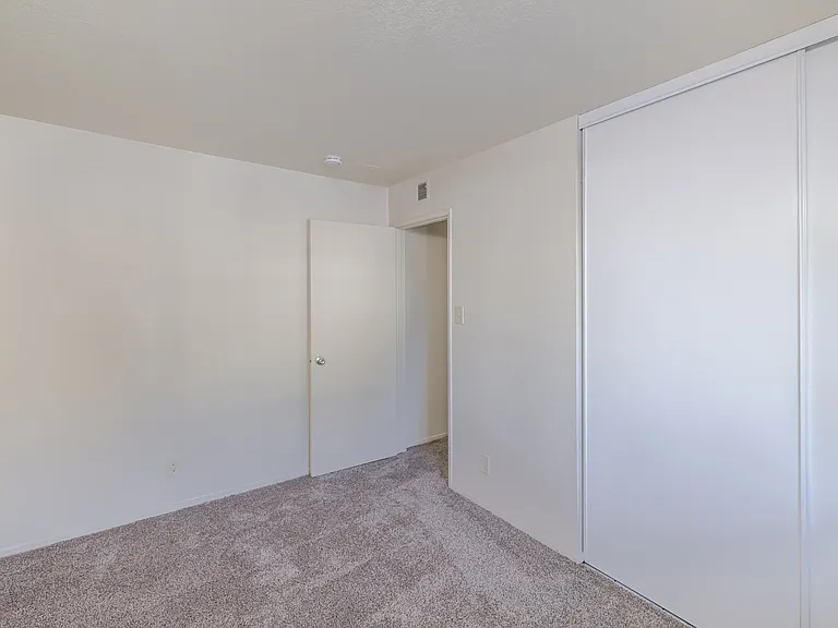 Bedroom A features a wide sliding-door closet, offering ample storage to keep your space clutter-free.